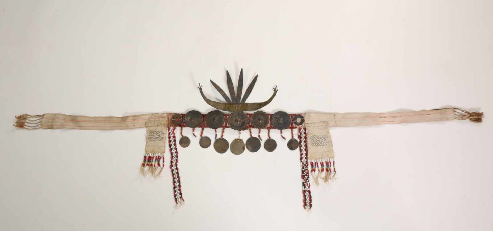 Timor, headhunters jewellery;woven textile with beads and metal ornaments and crown, h. 17 cm. [1]
