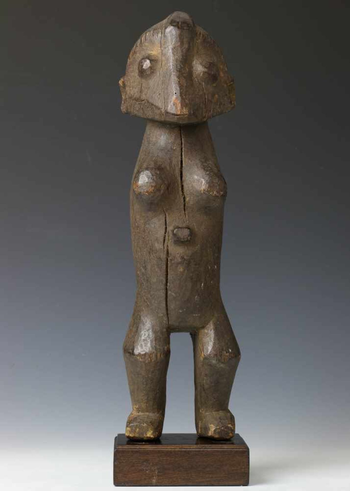 DRC., Zande, standing figure;zoomorph-anthropomorph figure with robust carved features. Hardwood