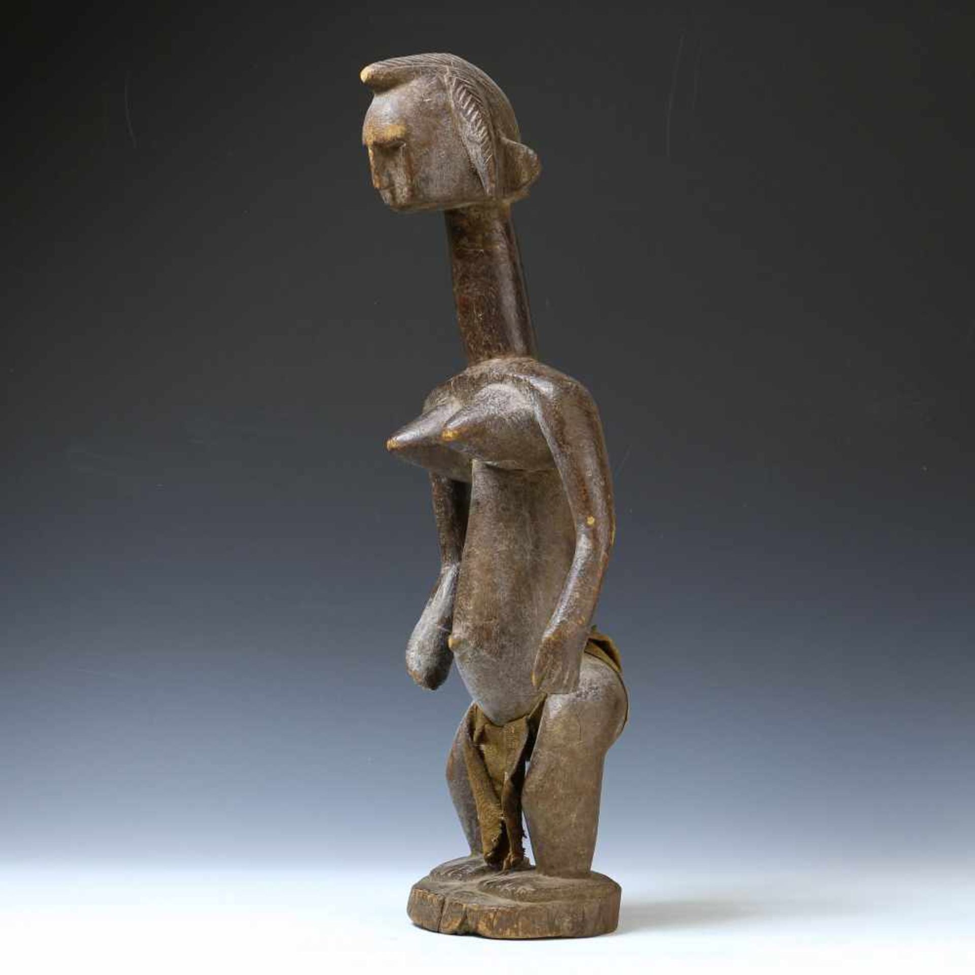 Ivory Coast, Senufo, standing female figurewith broad shoulders, elongated neck and hair in two