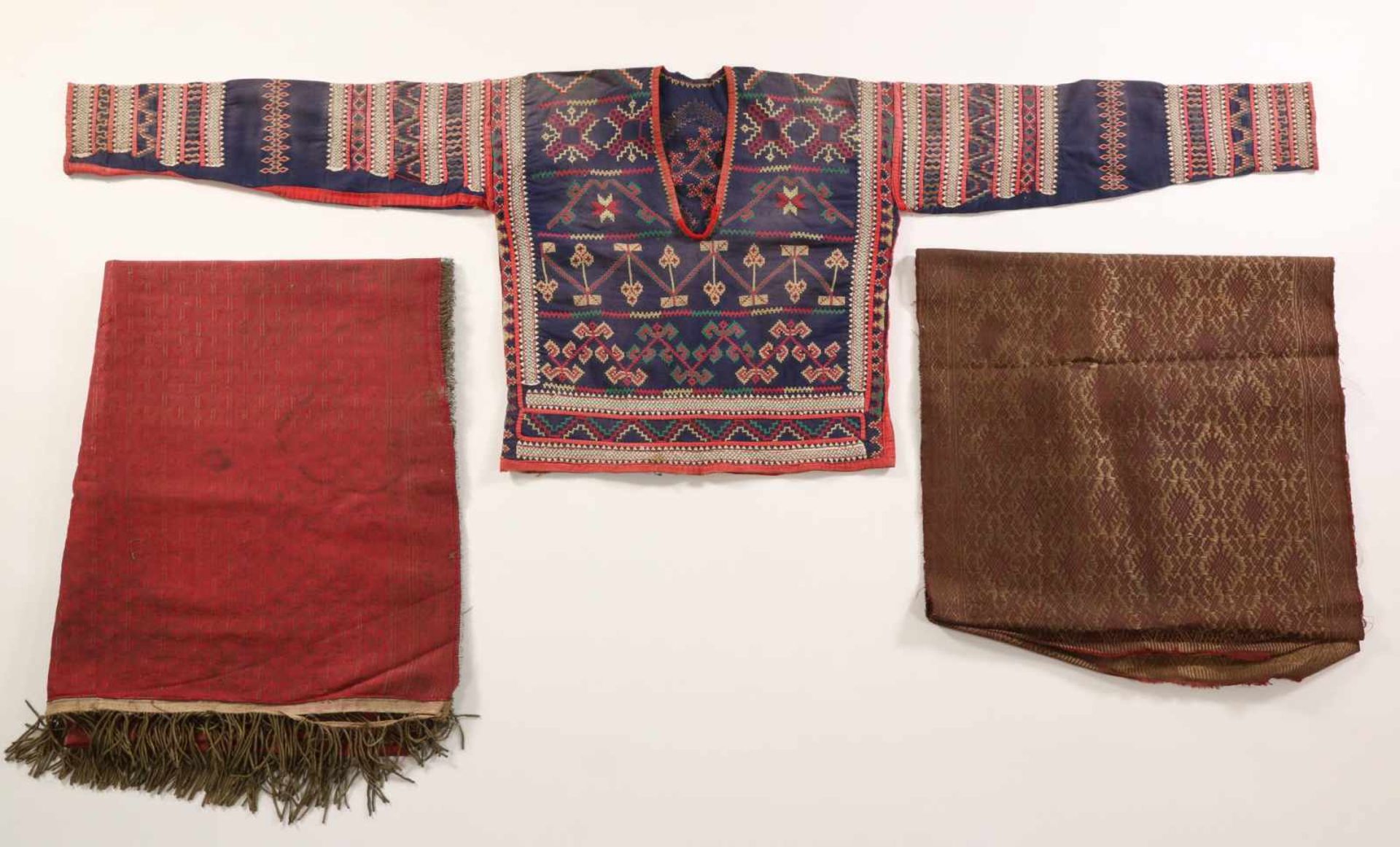 Philipinnes, four textiles, a Mindanao jacket and a brown Ikat clothMinagkabau, a red cloth with