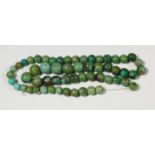 Tibet, a pair of necklaces with fine rounded turquoise- and silver beads