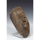 Nepal, carved wooden shaman mask with remains of lacquer seal, fangs, whiskers, goatee and crown,
