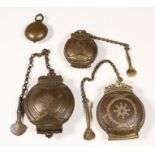 India, four brass and copper chalk containers, two with chain and small knife attached, 19e century