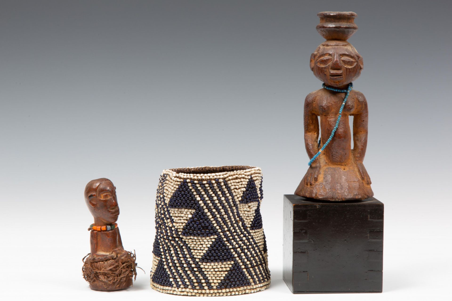 DRC., Luba, two halffigures and Cameroon, a beaded bracelet.