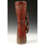Sepik, red painted wooden drum and a Bali silver alloy keris handle,