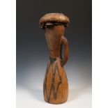 Papua, Humboldt Bay, drum of hourglass shape, the lower part decorated and blackened, plant fibre ba