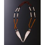Naga, two necklaces one with two pendants of slices Turbinella shell, one with two rolls decorated