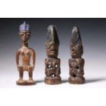 Nigeria, Yoruba, Oyo, Igana, male twin figure and two Oyo, Oshogbo twin figures