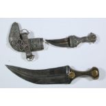 Jemen, two metal and silver alloy jambyia, one with a decorated shaft