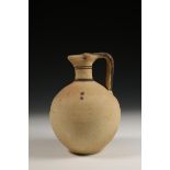 Cypriot bichrome ware jug, decoration of snake over the handle and small swastikas on the belly, 6th