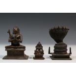 India, two brass deity statues and one of Naga, the seven- headed snake protector of the ascetic Bo