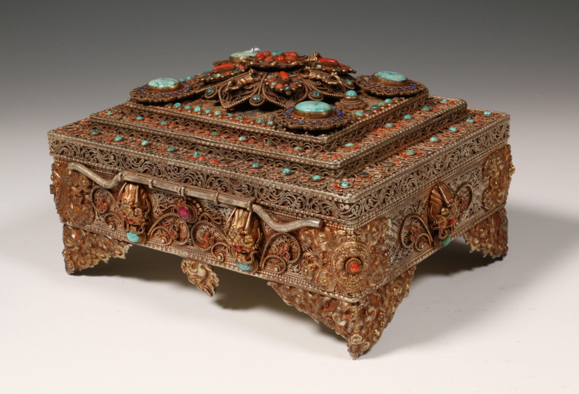 Tibet, decorated metal jewelry box, set with many semi precious stones, 20e century
