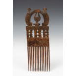 Ghana, Ashante, comb, topped by openworked panel, the half-figure with two horns surrounded by an ar