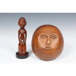Africa, round mask and a wooden final with seated female figure