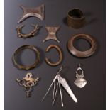 West Africa, some bronze and brass bracelets and Toeareg, some amulets and a metal set for personal