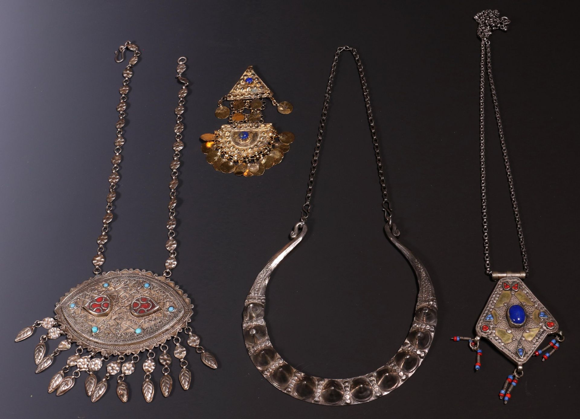 Afghanistan, necklace, two amulets on a chain and a gilded amulet