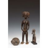 Ivory Coast, carved wooden pully and a Yoruba, open worked wooden lidded box