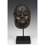 DRC., a carved wooden face mask,