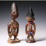 Nigeria, Yoruba, Igbomina Ajasse, male twin figure, with grimacing face, metal and beaded ornaments