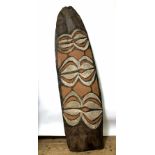 Papua, Asmat, Citak, small war shield, samas, with curved and straight motivs in white and red on a