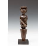 DRC., Bakongo, carved wooden figure in Colonial clothing,