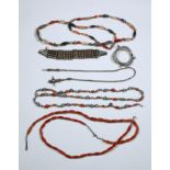 Southeast Asia, collection of three long necklaces with cornealines, one silver alloy belt and two b