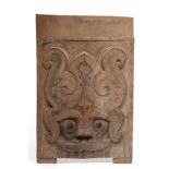 Sumatra, Toba Batak, wooden rectangular architectural pannel decorated with a Singa head