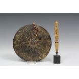 Timor, metal disc shaped breast ornament and a bone handle, possibly Moluccas.