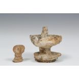 Syria, terracotta bust, 2nd mill. BC and a Roman earthenware oil lamp, 1st-3rd century,