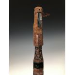 Papua, Cenderawasih Bay, ceremonial brush, the handle carved with a Korvar figure, details in black,