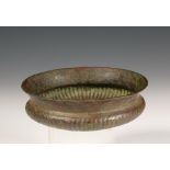 Roman, bronze dish, decorated with engraved floral patterns, the bottom gadrooned, 1-3rd century.