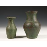 Roman, two bronze jars, one decorated with classic engravings, 1st century AD.