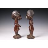 Nigeria, Yoruba, Ekiti, two twin figures, a male and a female, the male with a hood, the female hair