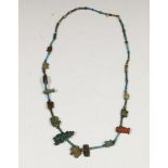 Egypte, faiece necklace with thirteen amulets, Late Periode
