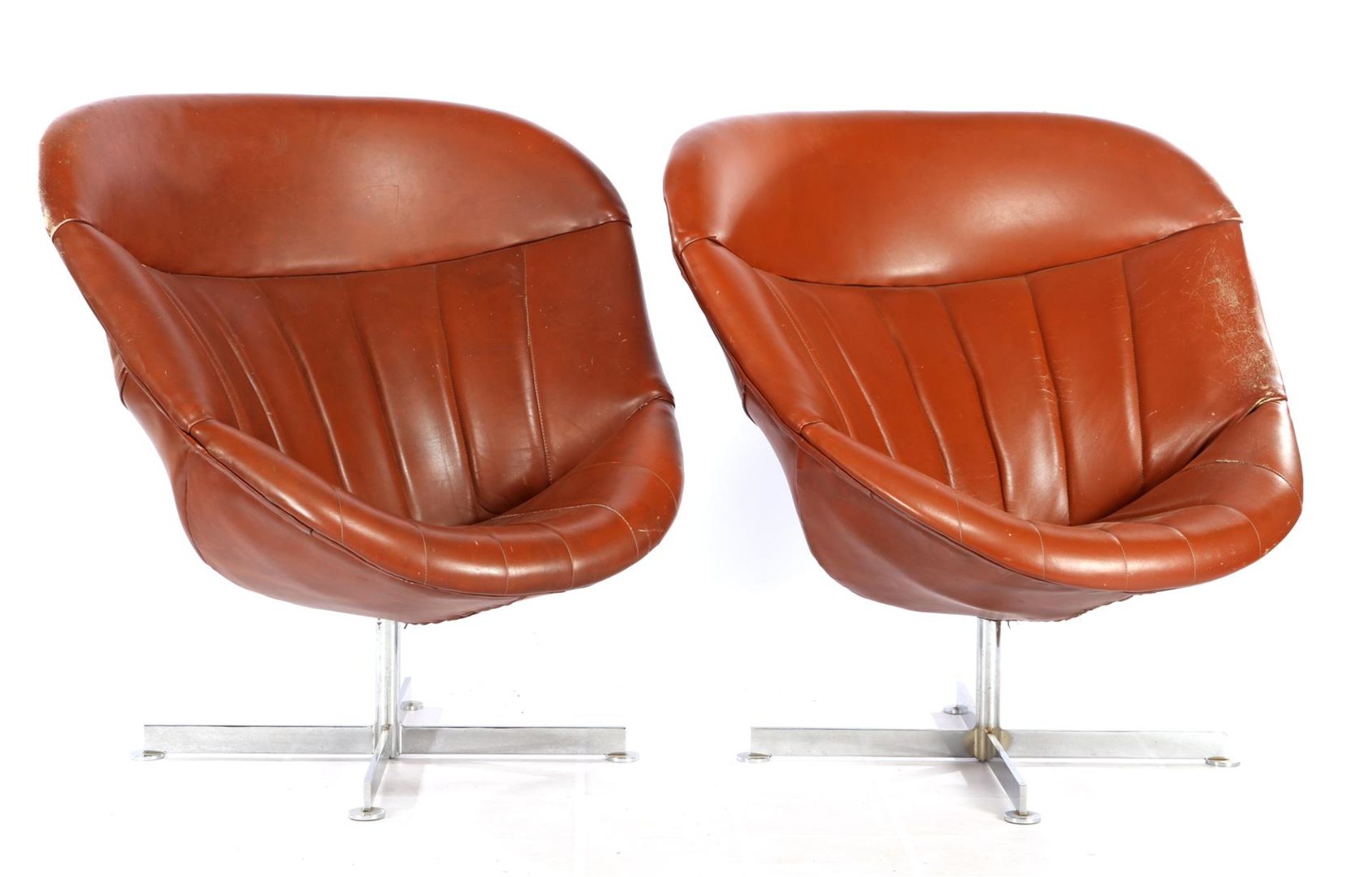 2 leather design & armchairs on metal star base, damage leather