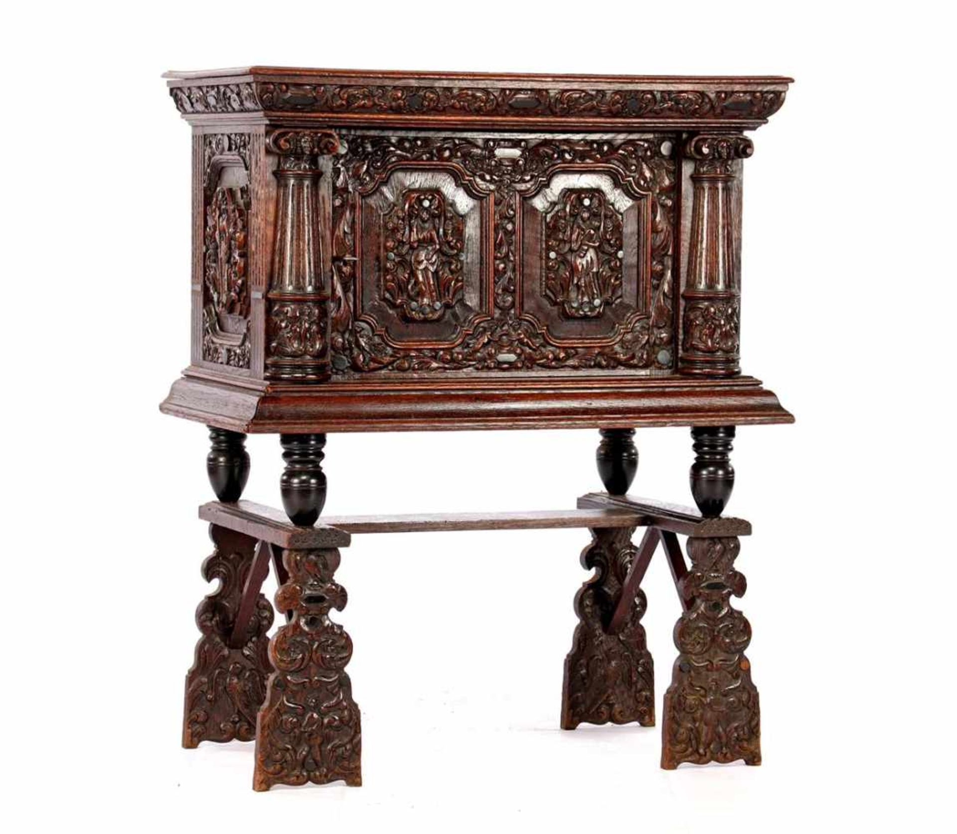 Antique oak cabinet with richly carved decor with columns, carved ornaments on the door with 2