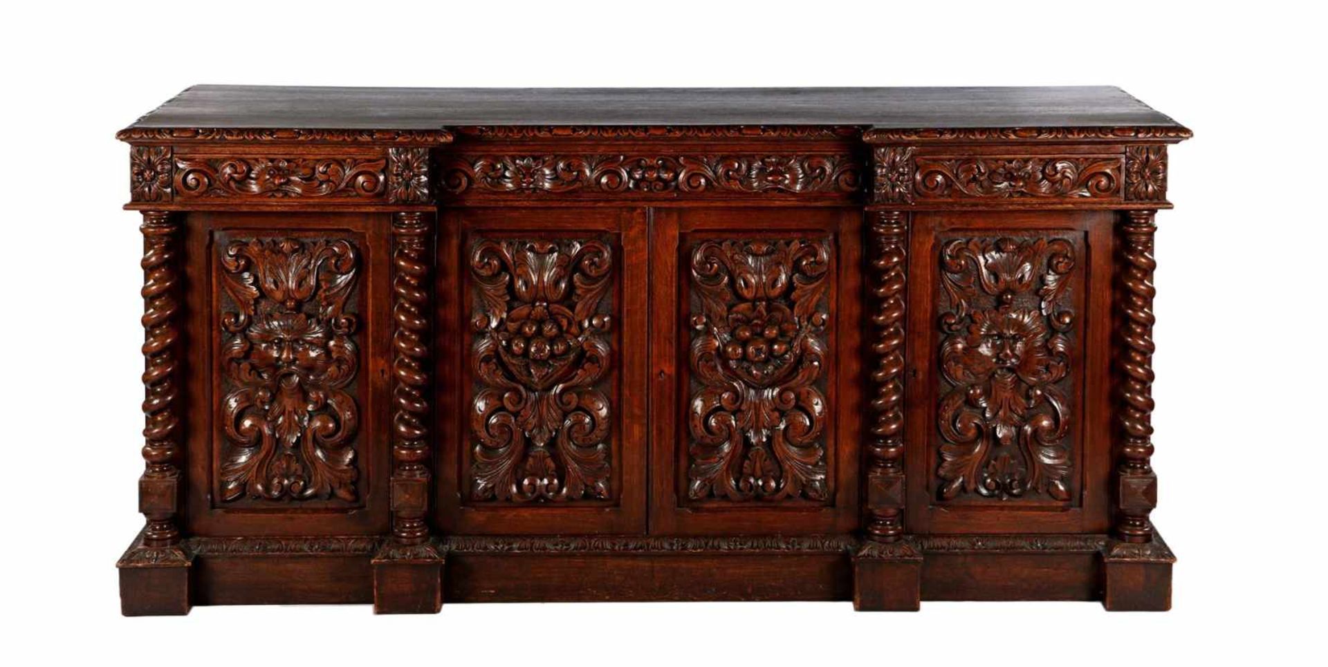 Dutch oak sideboard with richly carved decoration of masks, vine leaves and with twisted columns, 98