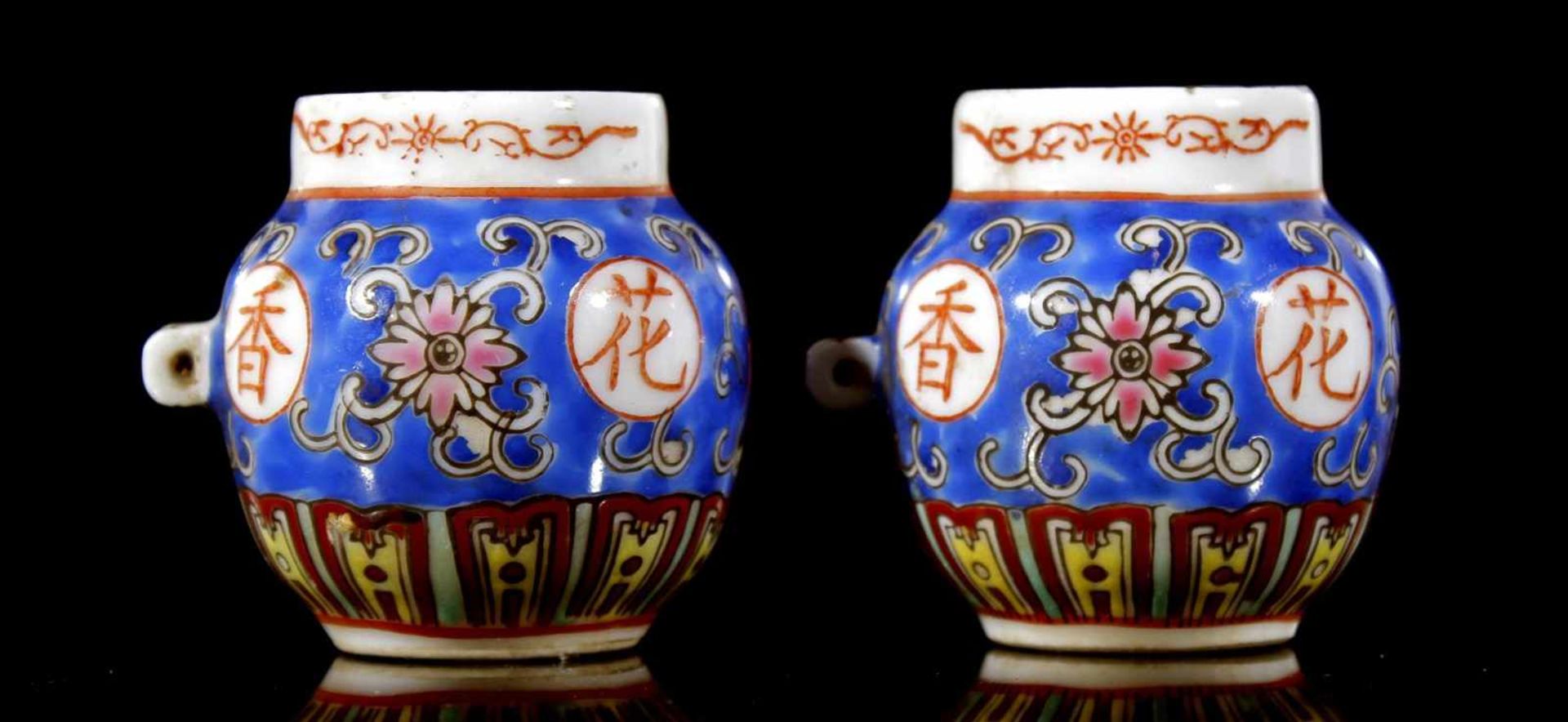 2 porcelain bird feeders with beautiful polychrome decor and hanging eyelets, China approx. 1900,