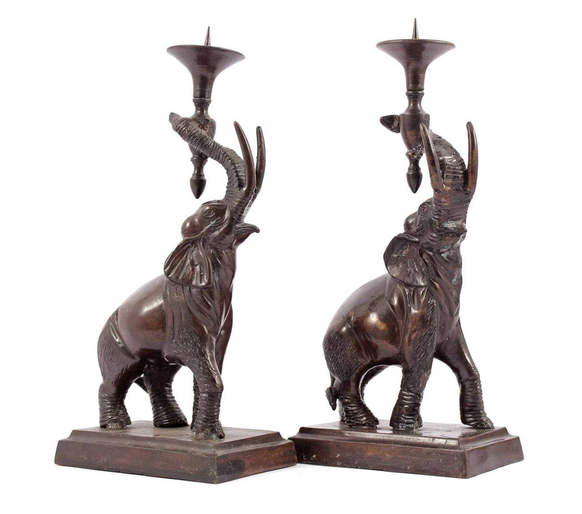 2 bronze colored metal candlesticks carried by elephants, presumably Maitland Smith, 37 cm high