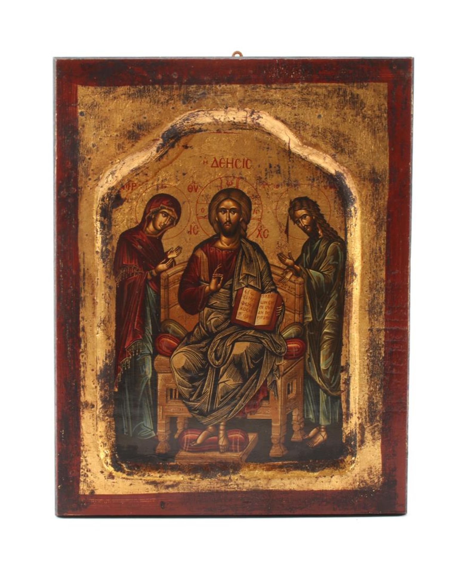 Byzantine icon depicting Christ with bible in hand, sitting on the throne, with Mary and Saint