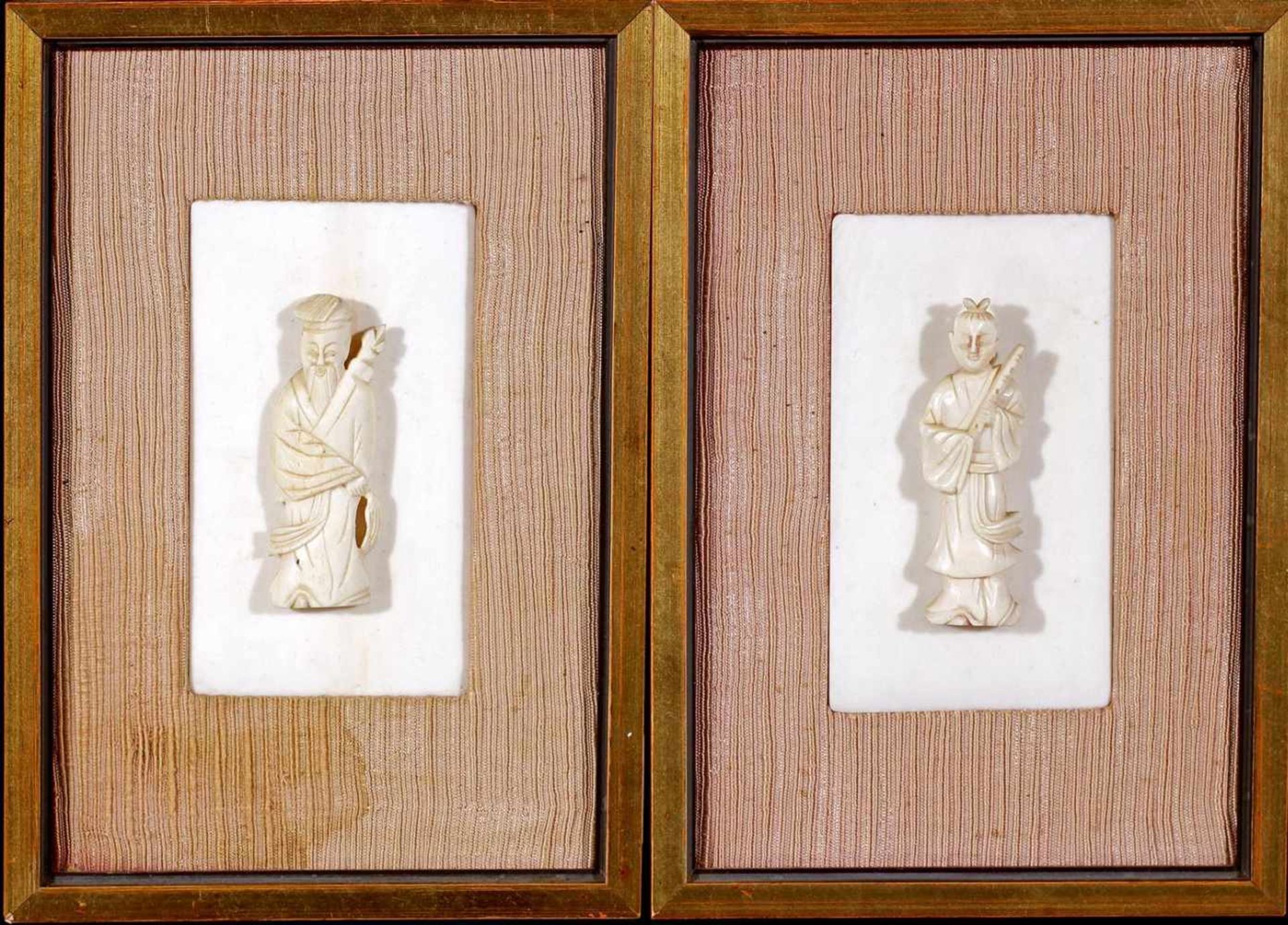 2 ivory tablets in frame with therefore a carved ivory statue of a person, China ca.1880, ivory is