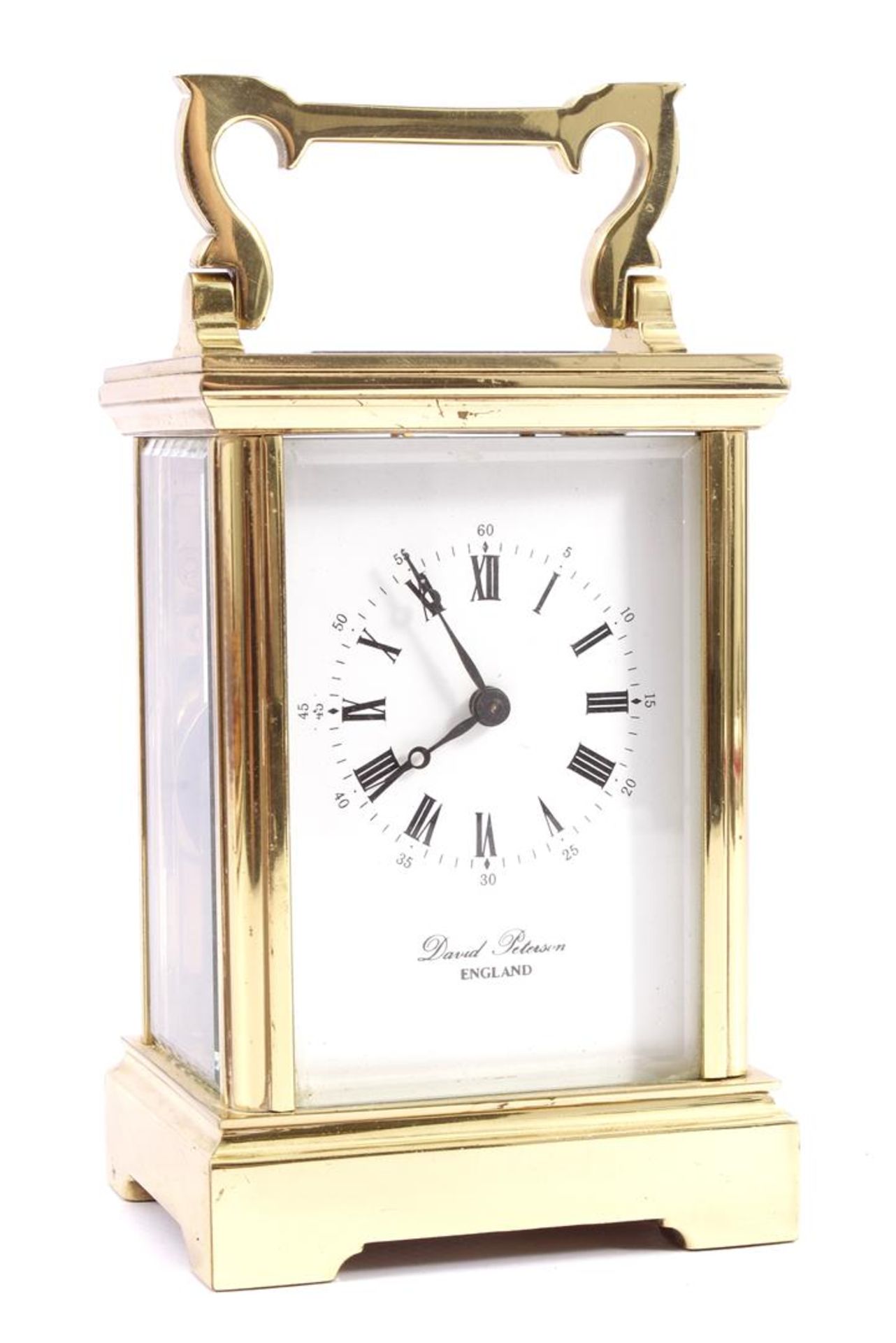 English travel alarm clock in brass case, with address David Peterson England on dial 15.5 cm