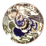 Rozenburg Den Haag pottery dish with polychrome decor, marked and year mark 1887, 23 cm diameter (