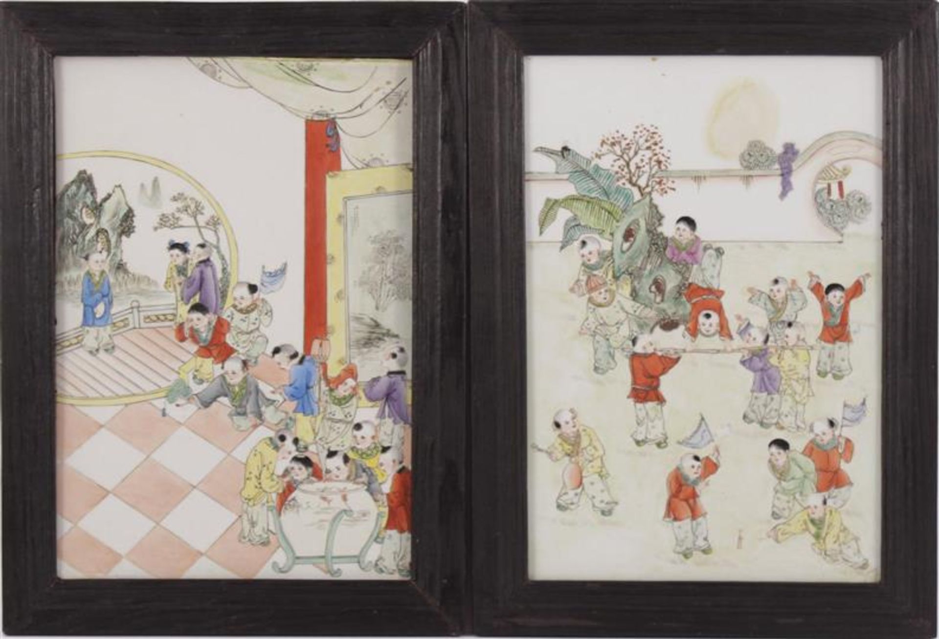 2 porcelain tiles with polychrome decoration of playing children, in wooden frame, outer size