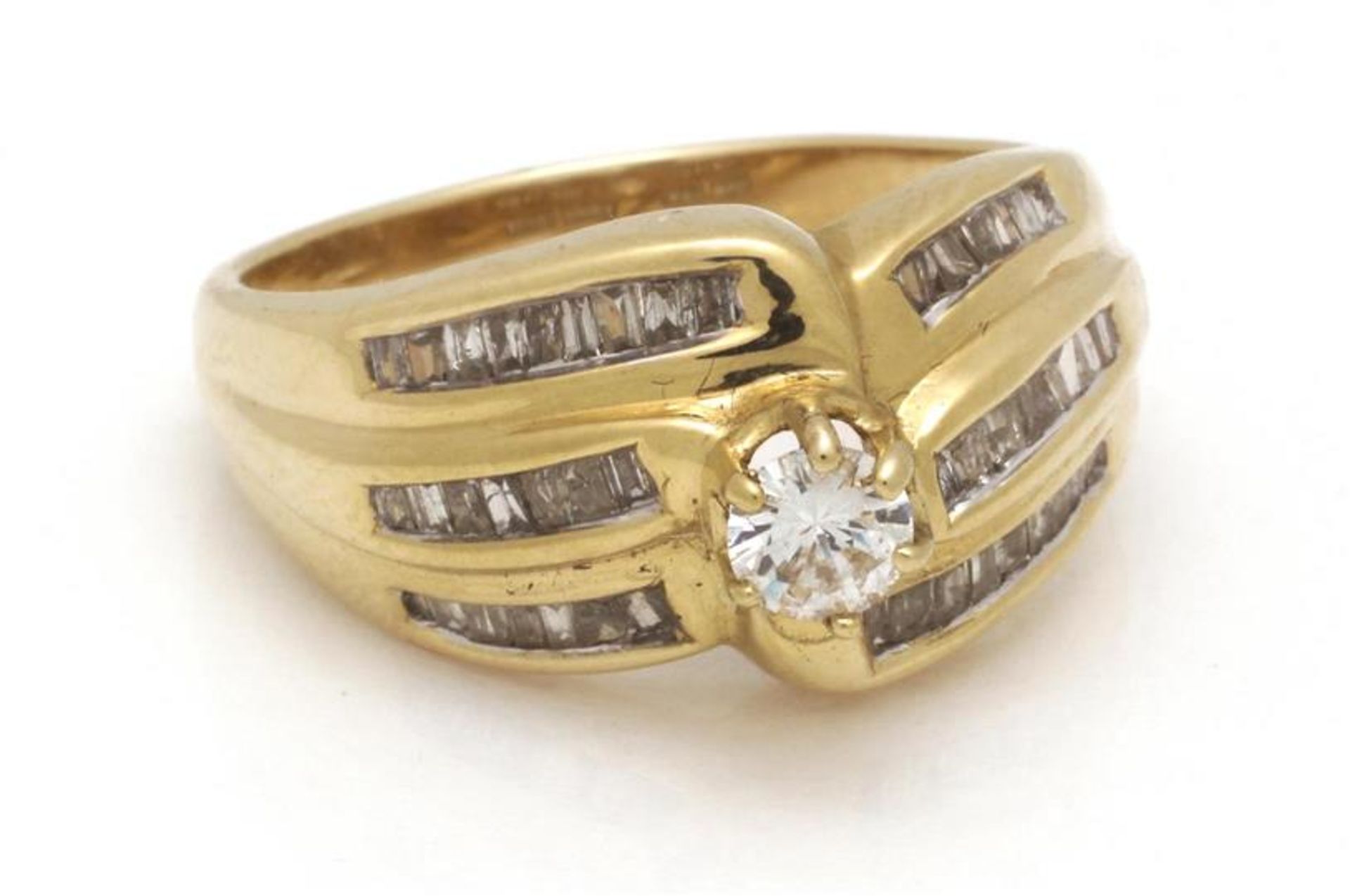 Gold fantasy ring, 18 krt., Set with brilliant cut diamond approx. 0.25 ct. And baguette cut diamond