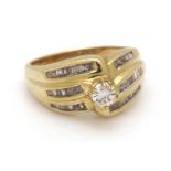 Gold fantasy ring, 18 krt., Set with brilliant cut diamond approx. 0.25 ct. And baguette cut diamond