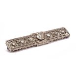 White gold Art Deco brooch, set with a brilliant cut diamond in the center, approx. 1.0 ct., With