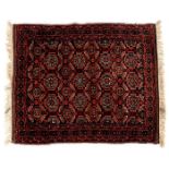 Hand-knotted wool carpet with oriental decoration Belouch, 109x89 cm