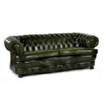 Green leather 2-seater Chesterfield sofa with curved front and standing on ball legs, 212 cm wide (