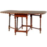 Oak gateleg table with contoured top edge and twisted base 71.5 cm high, total top size 148x106 cm